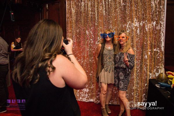 Event guests smiling during a photo shoot