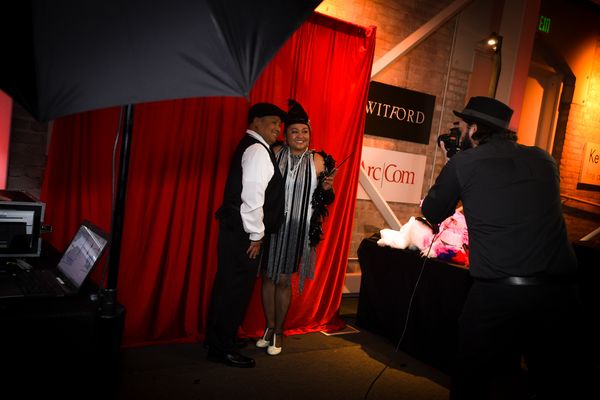 Corporate guests posing for a live photo shoot