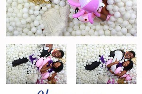 Bride posing in a ball pit photo booth