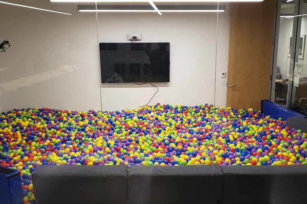 Ball pit photo booth setup in a conference room