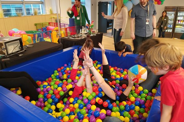 Party guests creating a ball pit photo booth moment