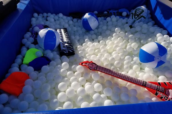 Ball pit photo booth setup with props