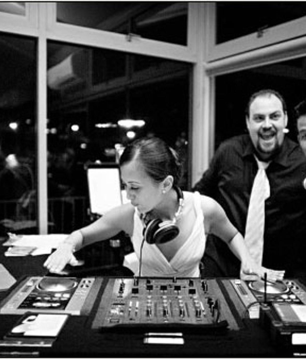 Wedding DJ speaking with a bride during a reception
