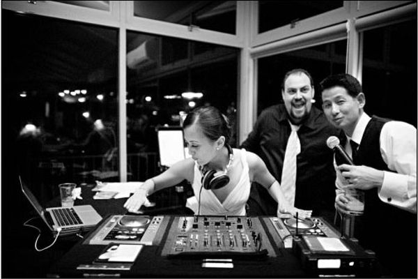 Wedding DJ interacting with a smiling bride