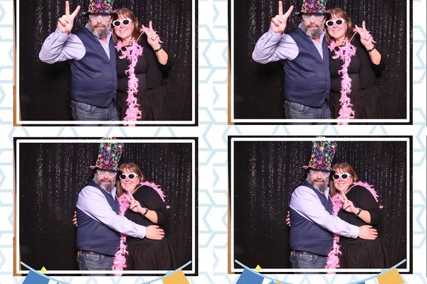 Classic photo booth guests posing at an event