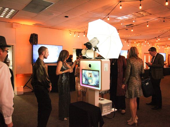 Corporate guests using an open style photo booth