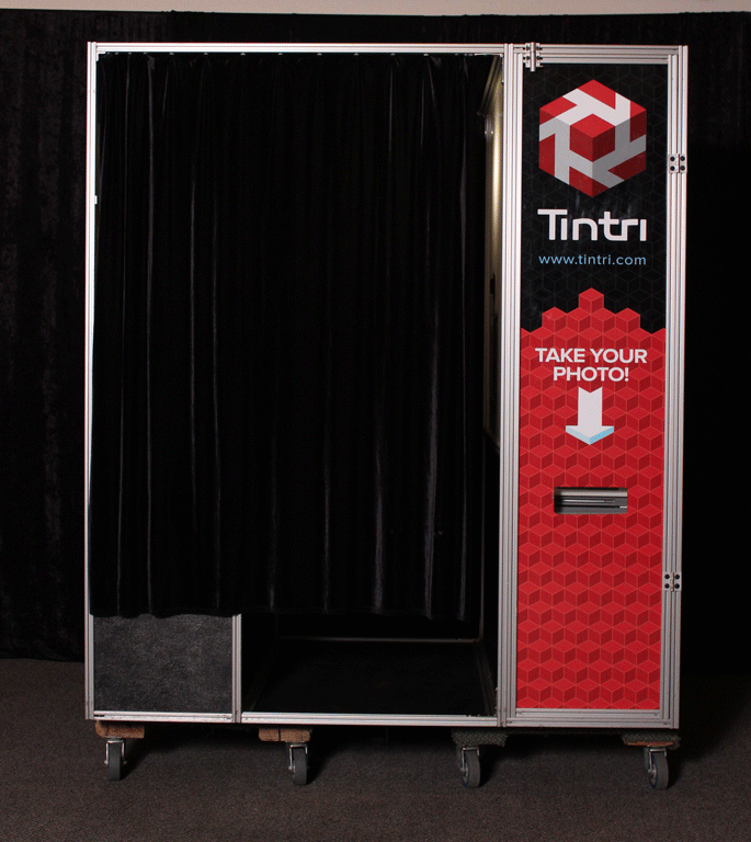 Custom photo booth experience with branded event booth display