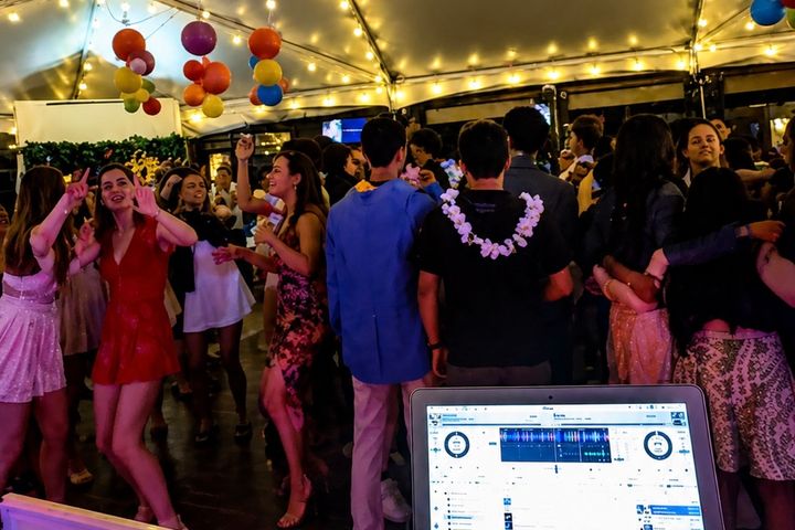 Wedding guests smiling with silent disco headphones