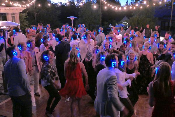 Outdoor event dance floor under warm lighting