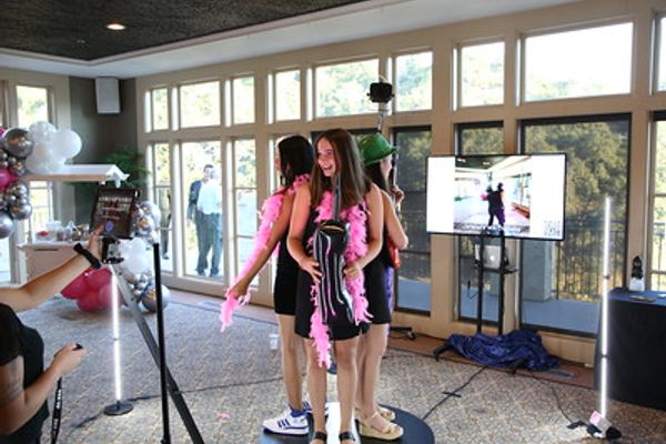 Guests watching the 360 photo booth experience
