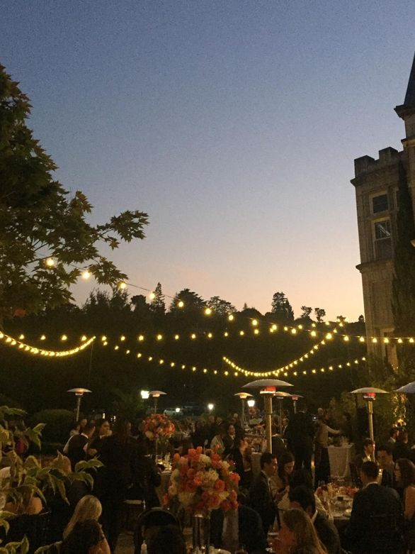 Market lights strung over a courtyard event