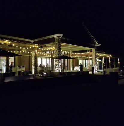 Outdoor wedding patio with warm market lights