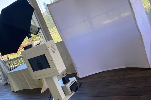 White open style photo booth setup at an event