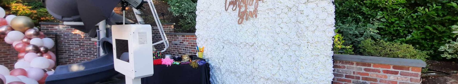 Open style photo booth with a white backdrop