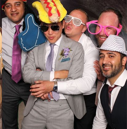 Students using a photo booth at an event