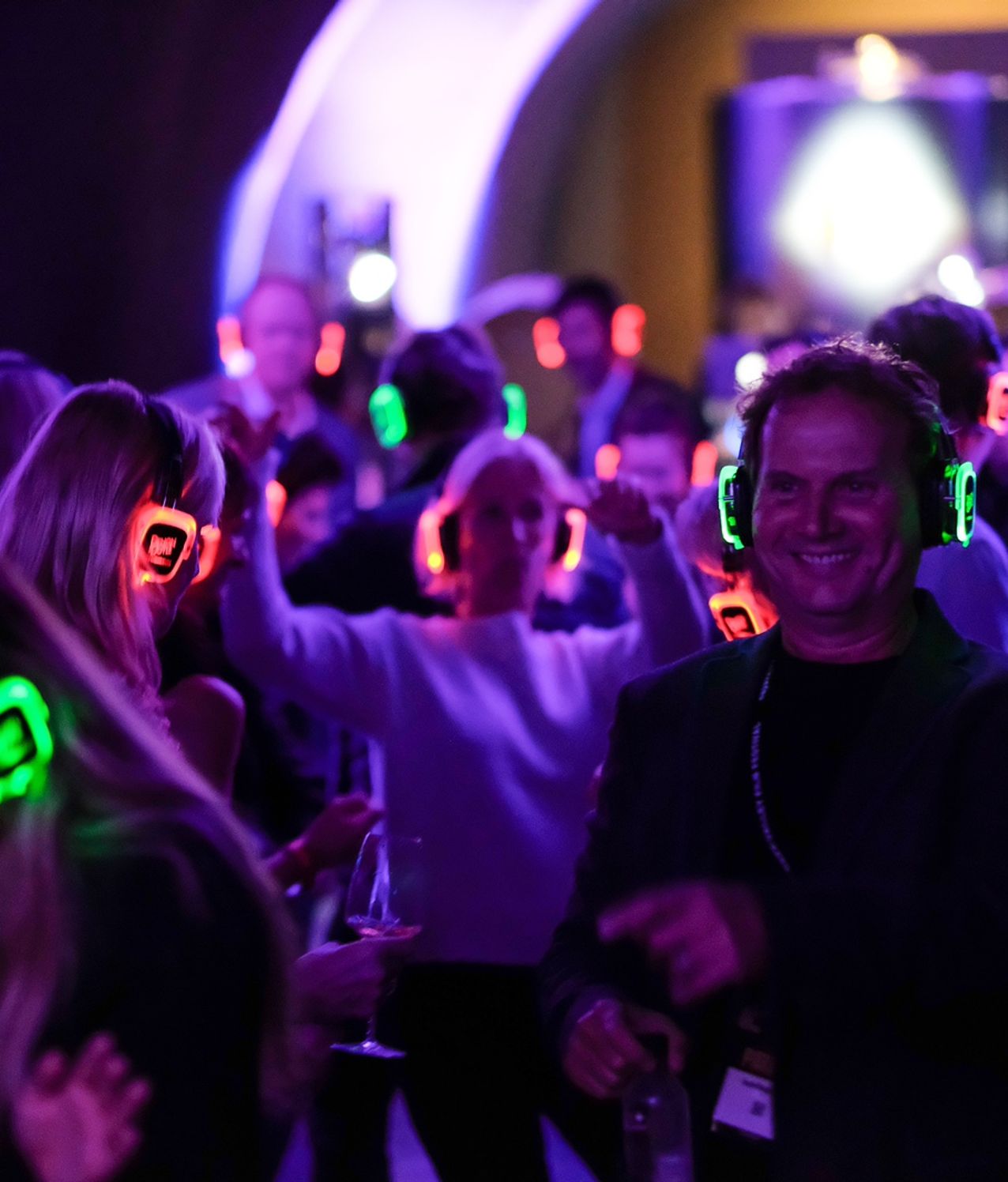 Guests dancing with silent disco headphones at an event