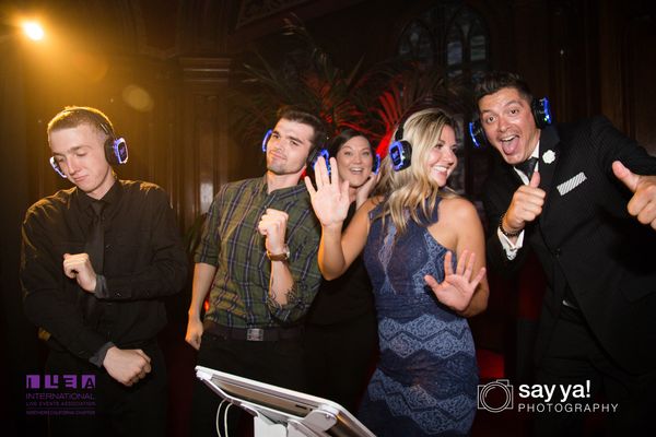 Event guests enjoying silent disco with glowing headsets