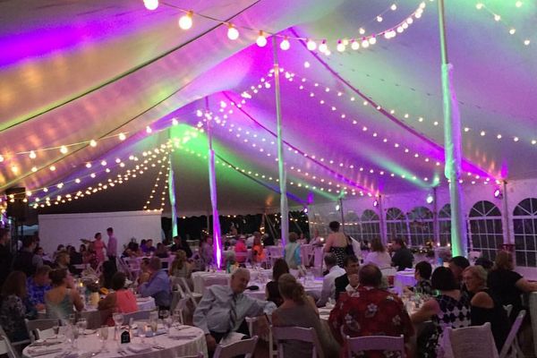 Branded event production setup with colorful lighting